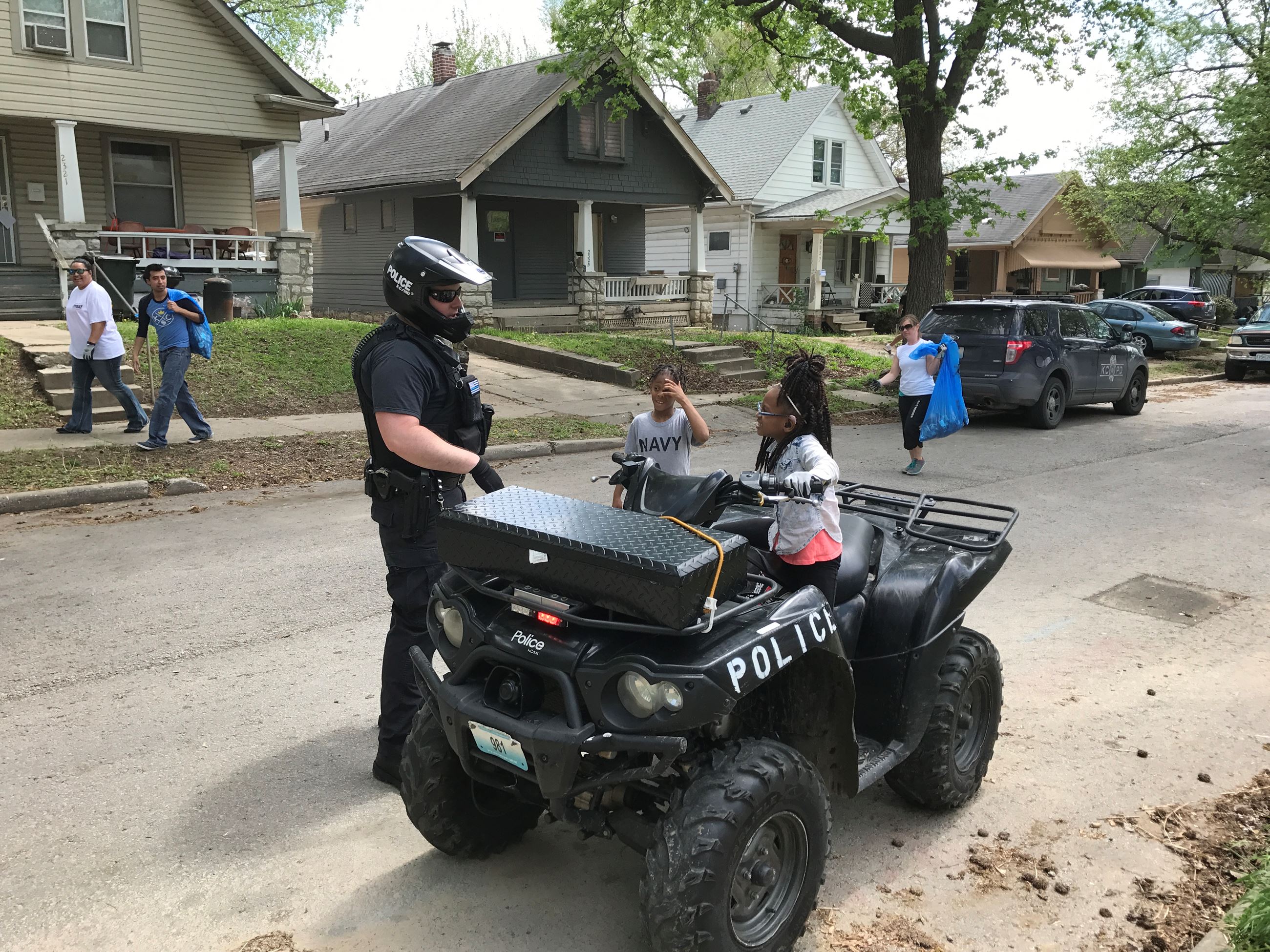 Neighborhood children have some fun revving the engine